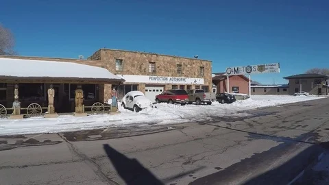 Wide Pan Route sixty six Main Street On Snowy Winter Day  Williams Arizona Stock Footage 71939541