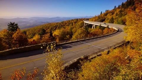 Wide pan shot of a car on the iconic Linn Cove Viaduct on the Blue Ridge Parkway Stock Footage 103787366
