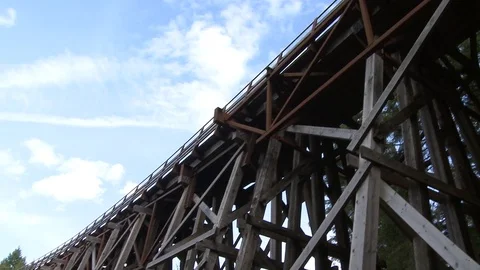 Wide pan shot of large train trestle Stock Footage 75243097