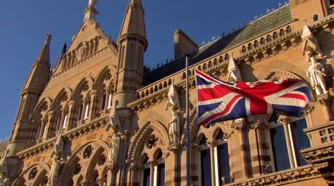 Wide Pan of Union Jack in Front of Guildhall Stock Footage 61641081