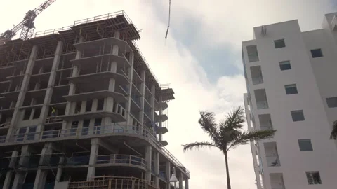 Wide pan up view of a large building under construction  in St. Petersburg, Flor Stock Footage 264556253