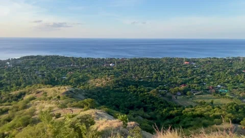Wide Panning Panoramic Green Mountains and Ocean View Pemuteran Bali Stock Footage 335941285