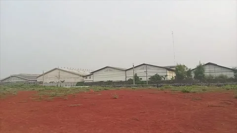Wide Panning Shot of Housing Complex and Passing Train Vídeo Stock 336437506