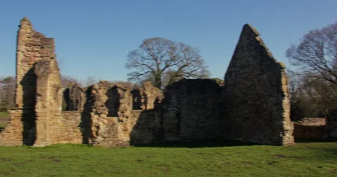 Wide panning shot of the south side Elevation of Basingwerk Abbey, Stock Footage 344815700