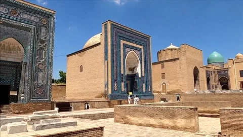 Wide panning shot of tourists exploring the historic Shah-i-Zinda complex Stock Footage 336807439