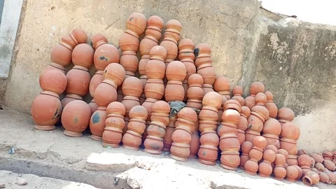 Wide Panning View Of Clay Water Pots For Sale On Street Kano Nigeria Stock-Footage 331069295