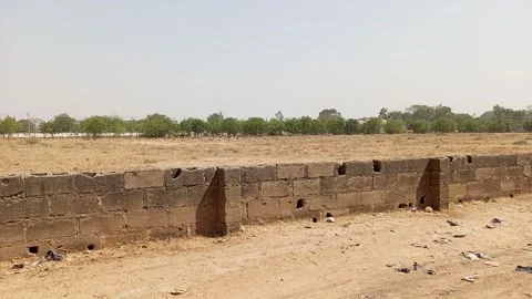 Wide Panning View Of Graveyard Enclosed By Aged Wall Kano Nigeria 動画素材 331069409