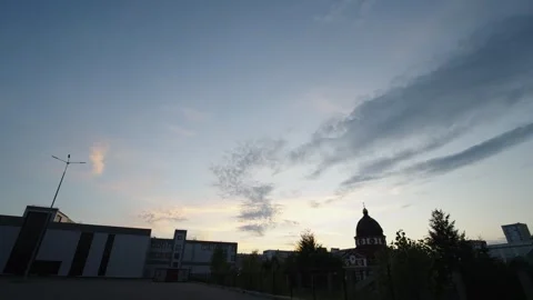 A wide panorama of the pre-sunset sky with cirrus clouds above the dark Stock Footage 337838694
