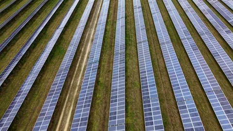 Wide panoramic aerial view of a modern green energy solar park integrated into Stock Footage 340897814