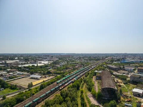 Wide panoramic aerial view of multiple cargo train lines in industrial rail.. Fotos Stock