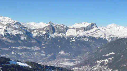 Wide panoramic aerial view of the snow-covered Alps mountains above Passy and Stock Footage 346671627