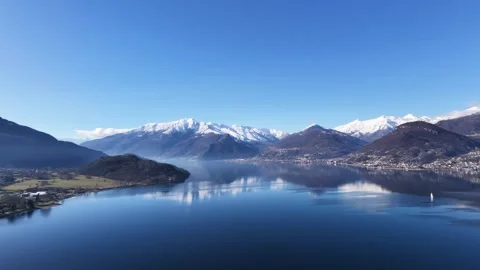 Wide panoramic drone shot over Lake Como and surrounding mountains Video stock 328010031
