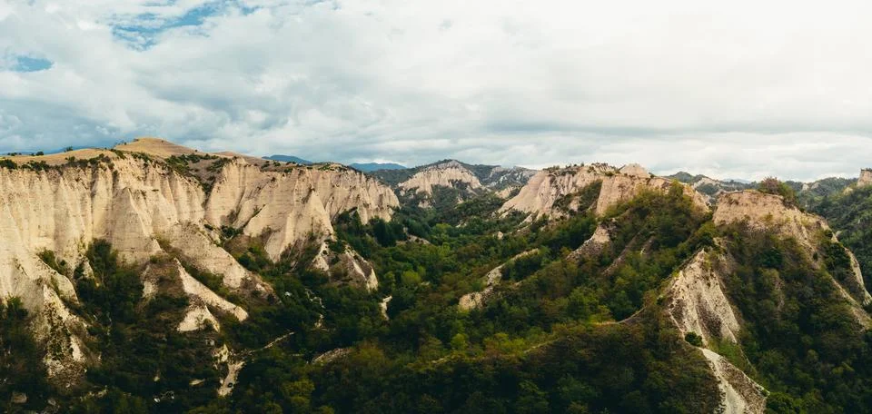 Wide panoramic drone view of eroded sandstone cliffs. 스톡 사진