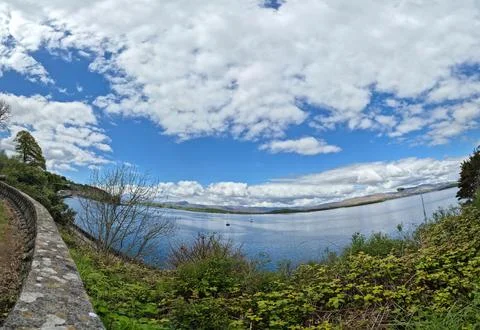 Wide panoramic lake landscape with dramatic clouds Фото