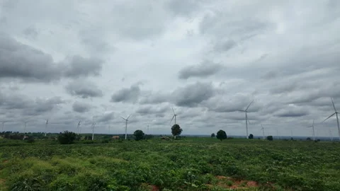 Wide panoramic landscape of multiple wind turbines in rural field farm Stock Footage 343197328