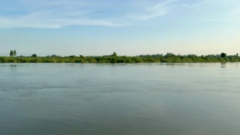 Wide panoramic shot of flowing calm river landscape under sky video Видео 339931156
