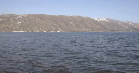 Wide Panoramic Shot of Lake Sevan and Mountain Range, Armenia Stock Footage 326554419
