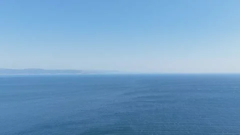 Wide panoramic view of the Atlantic Ocean from the coast near Faro de Fisterra Stock Footage 346701851