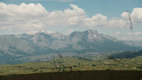 A wide panoramic view of the Durmitor mountain range under dramatic summer Vídeo Stock 342408955
