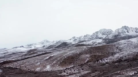 Wide panoramic view of snow capped mountain range in winter season Stock Footage 342095743