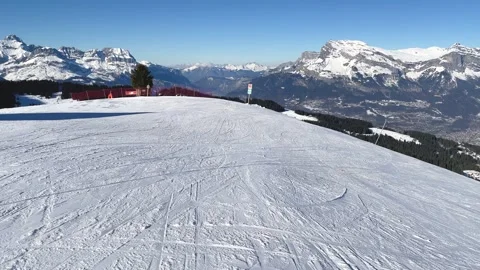 Wide panoramic view of a snow-covered ski slope at Megeve in the French Alps Stock Footage 346669924
