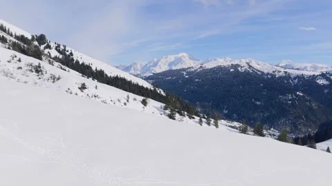 Wide panoramic view of a snow-covered alpine slope in the Massif du Mont Blanc Stock Footage 346672433