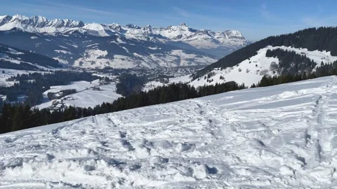 Wide panoramic view of a snow-covered mountain summit near Megeve in the French Stock Footage 346675931