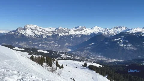Wide panoramic view of the snow-covered French Alps above Passy and Chamonix Stock Footage 346679173