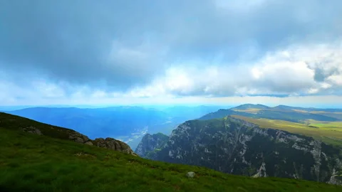 Wide panoramic view of steep rocky cliffs and valley Stock-Footage 333147699