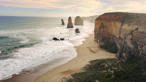 Wide panoramic view of the Twelve Apostles limestone sea stacks and towering Stock Footage 345287775