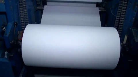 A wide paper roll is rotated on the machine for further cuts 2 Stock Footage 64767166