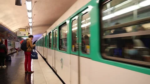 Wide Paris Metro Train Coming into Station Stock Footage 165837882