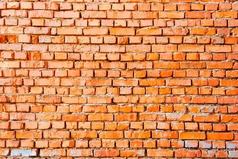 Wide pattern of an orange brick wall Illustrazione stock