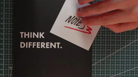 Wide perspective of Think Different journal with Notes paper note Stock Footage 341269459