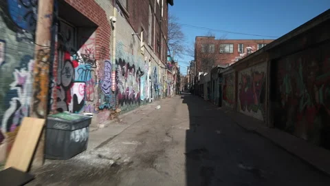 A wide point of view bicycle ride through an inner city Toronto alleyway Stock Footage 150843586