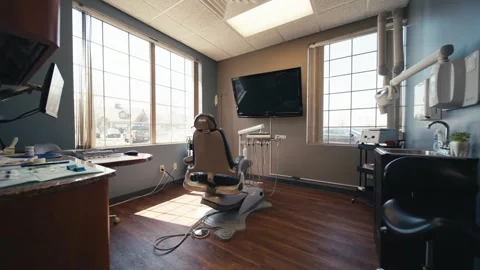 Wide push in of a dental office or teeth cleaning room surrounded by Stock Footage 274820845