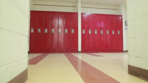 Wide push shot of red lockers in hallway Stock Footage 41454893