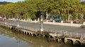 Wide quay along Nervion river and view on colorful buildings in Bilbao, Spain HD Footage