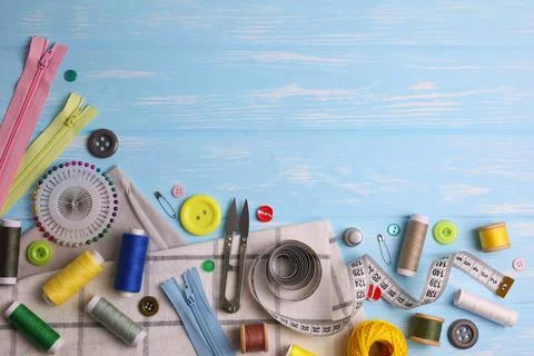 A wide range of sewing materials and tools is located on a colored background Foto stock