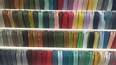A wide range of small zippers for clothes in different colors Vídeos de archivo 306575807