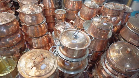 Wide range of traditional copper cookware at Vakil Bazaar, Iran Stock Footage 100737988