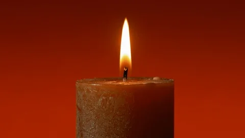 Wide red candle stable flame on red background Stock-Footage 122864505