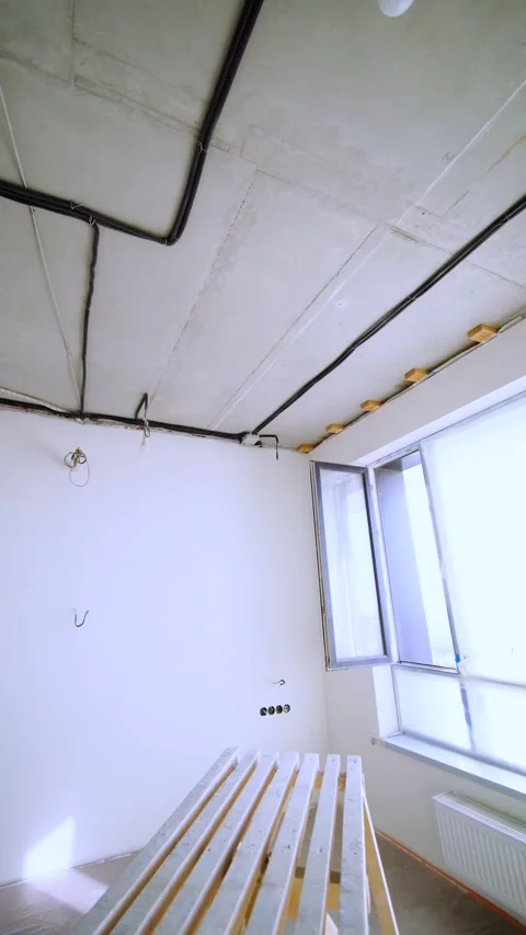 Wide Renovation Interior With Exposed Wiring and Open Window 動画素材 342990584