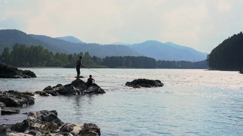 A wide river against the background of mountains 스톡 동영상 79733241