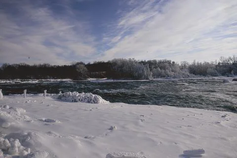 Wide River Bend Bordered By Snowy Winter Banks Stock Photos