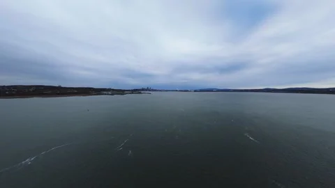 Wide river drift under layered grey clouds Stock Footage 320849447