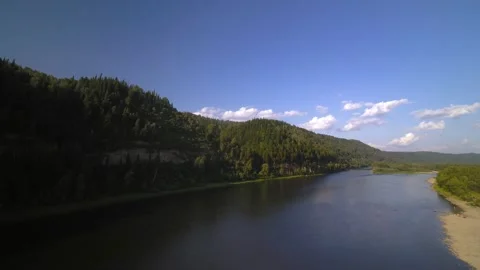 A wide river in a green forest Stock Footage 145293385