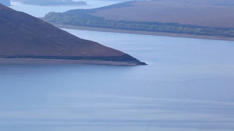 Wide river with hilly islands on a cloudy foggy day. Dniester, Ukraine, Stock Footage 90418317