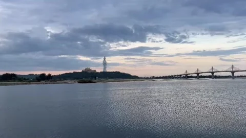Wide River Landscape with Bridge and Monument at Sunset Stock Footage 337835460