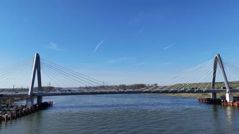 Wide river view of modern bridge under construction Stock Footage 331200522